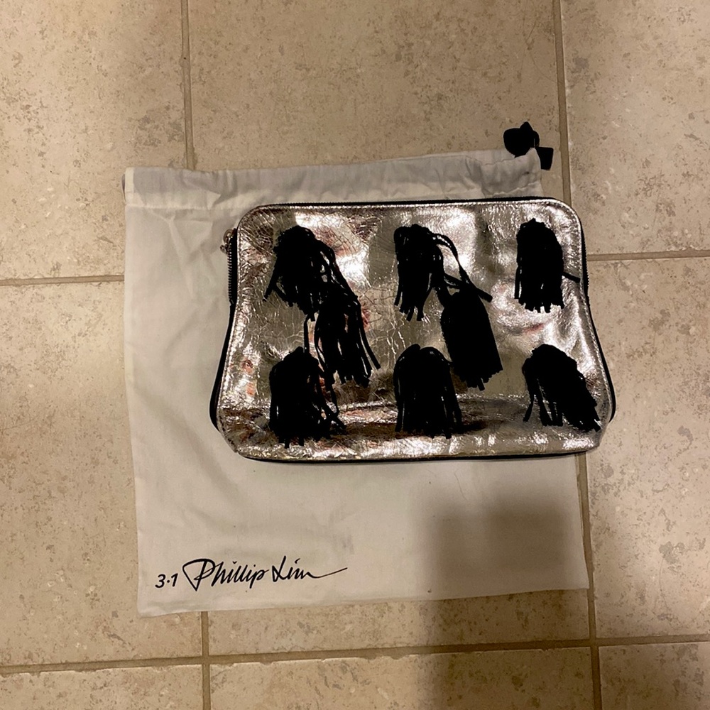 Philip Lim silver clutch with pom poms